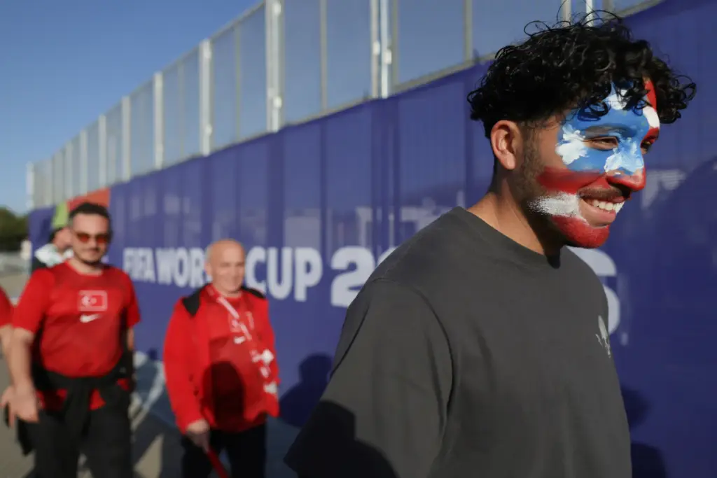 Fans arrive to watch World Cup Group D soccer match...