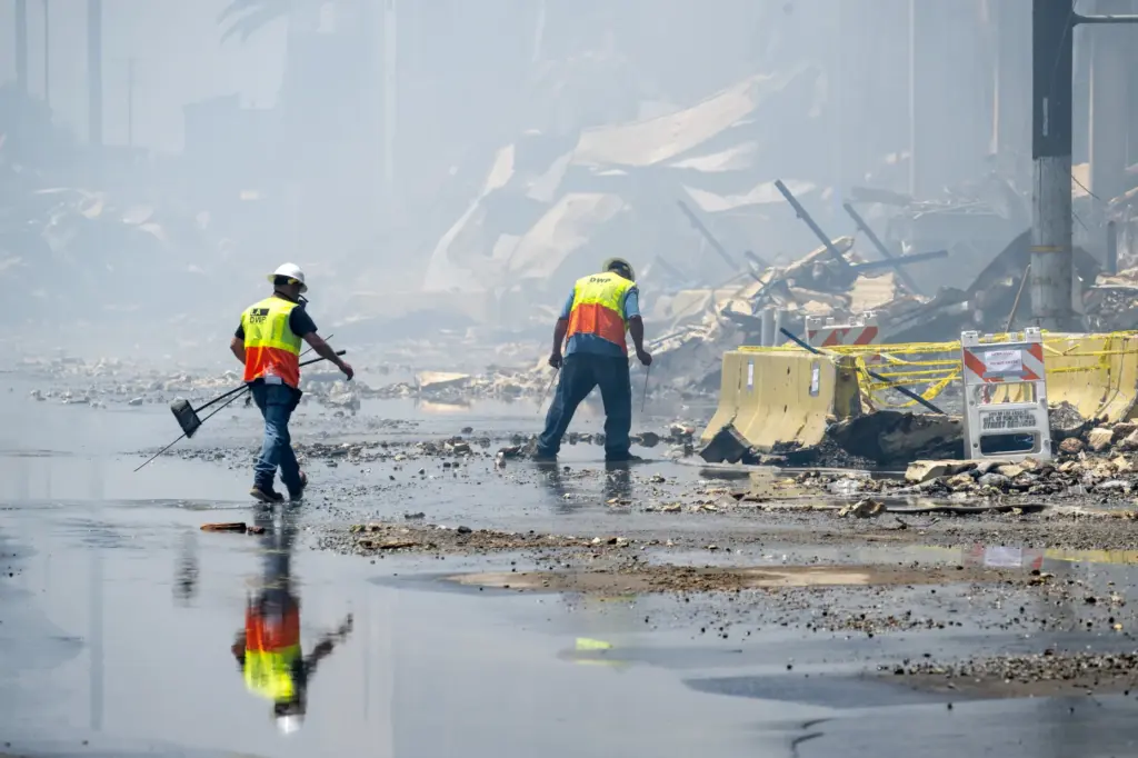 DWP workers in smoke outside of the Lineage warehouse fire...