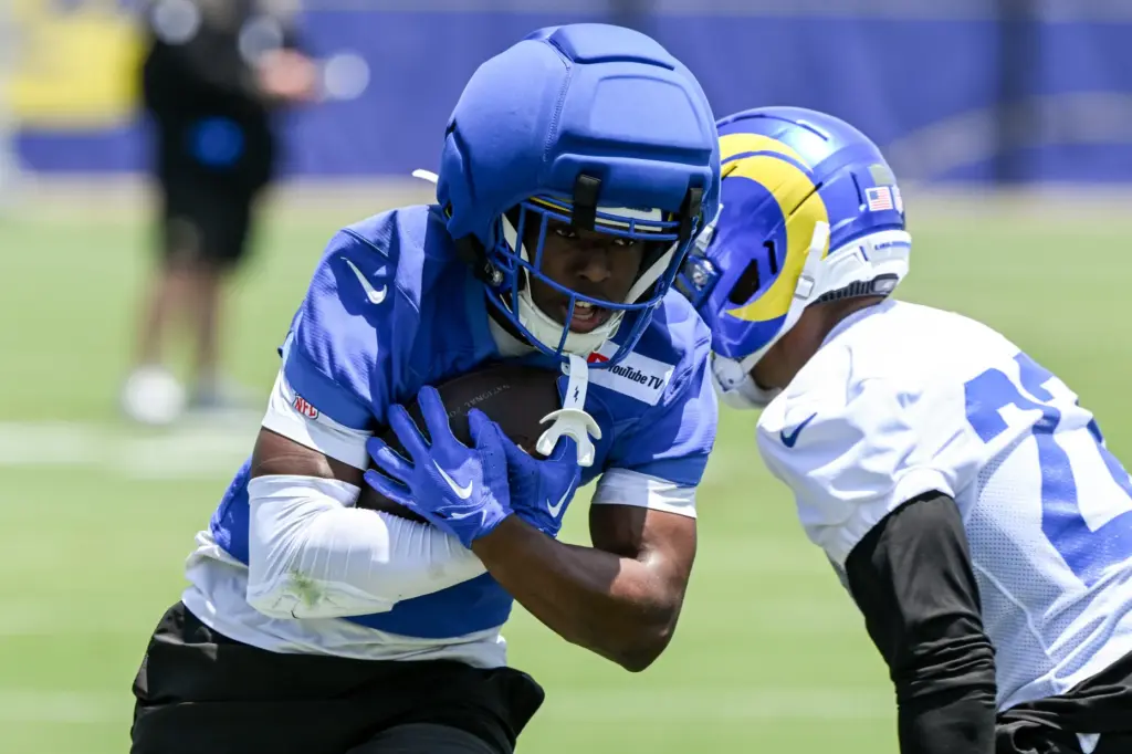 Rams wide receiver Xavier Smith (19) runs with the ball...