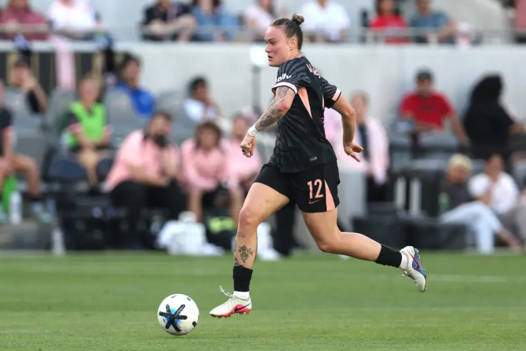 Angel City FC midfielder Maiara Niehues moves the ball up...