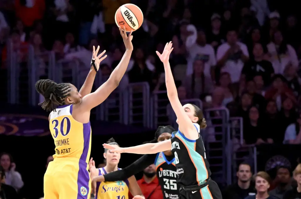 Los Angeles Sparks forward Nneka Ogwumike (30) takes a three...