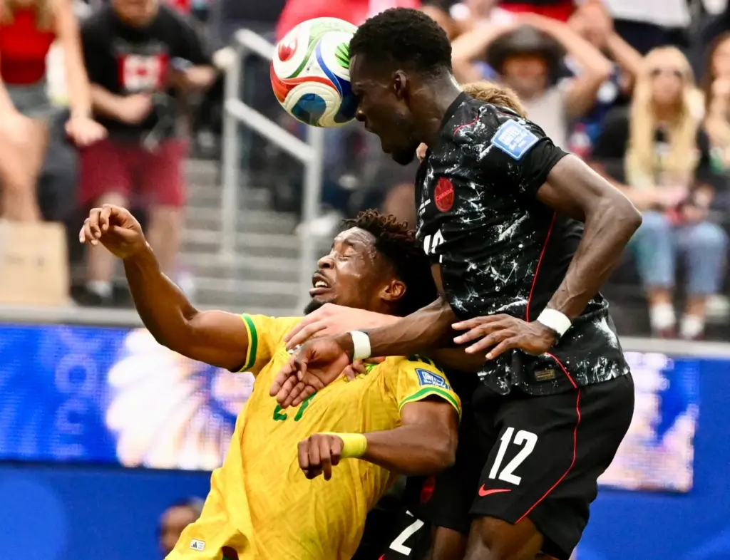 Canada defender Derek Cornelius (13) with the header shot over...