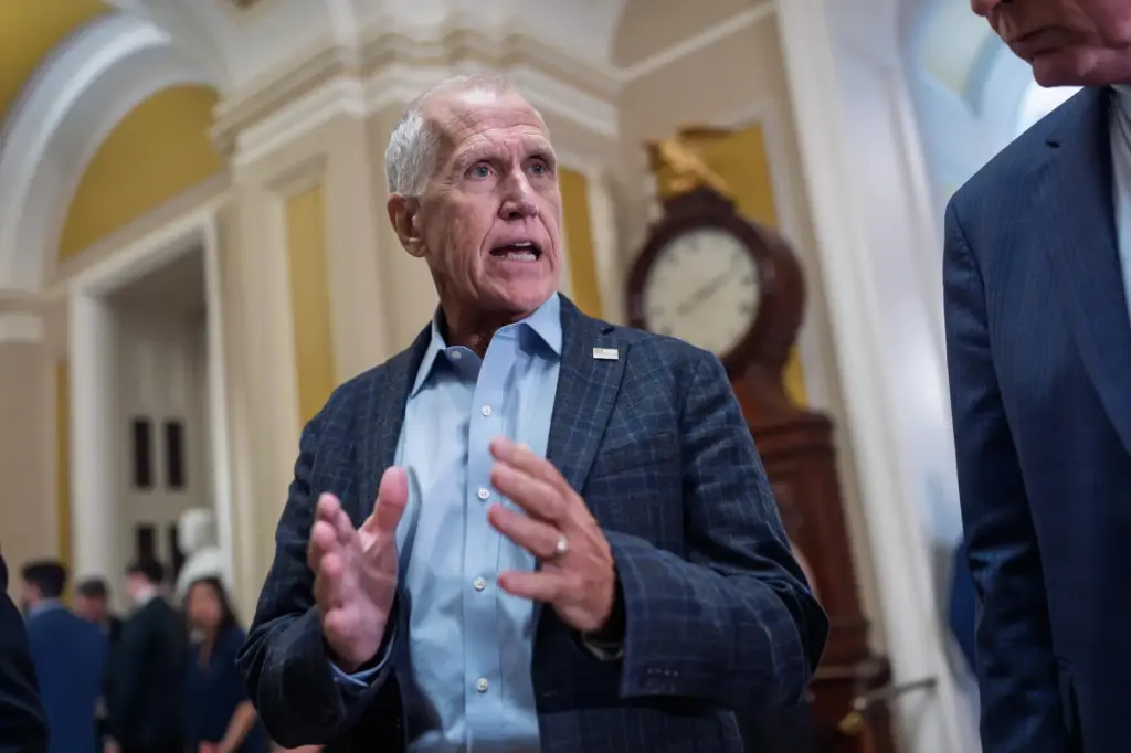 Sen. Thom Tillis, R-N.C., heads to the chamber following a...