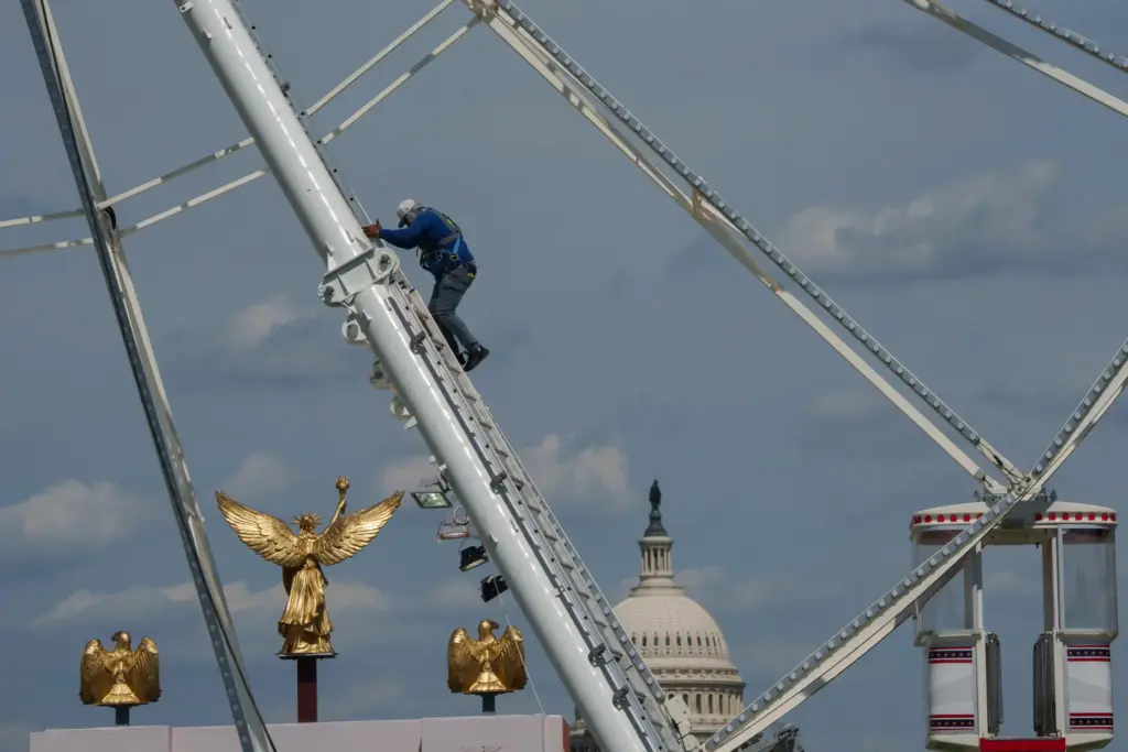 The U.S. Capitol is seen in the background of the ferris wheel.