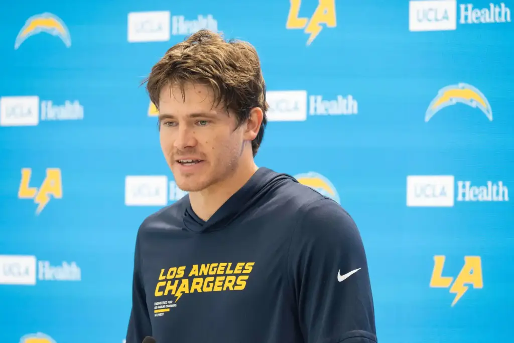 Chargers quarterback Justin Herbert takes questions during a press conference...