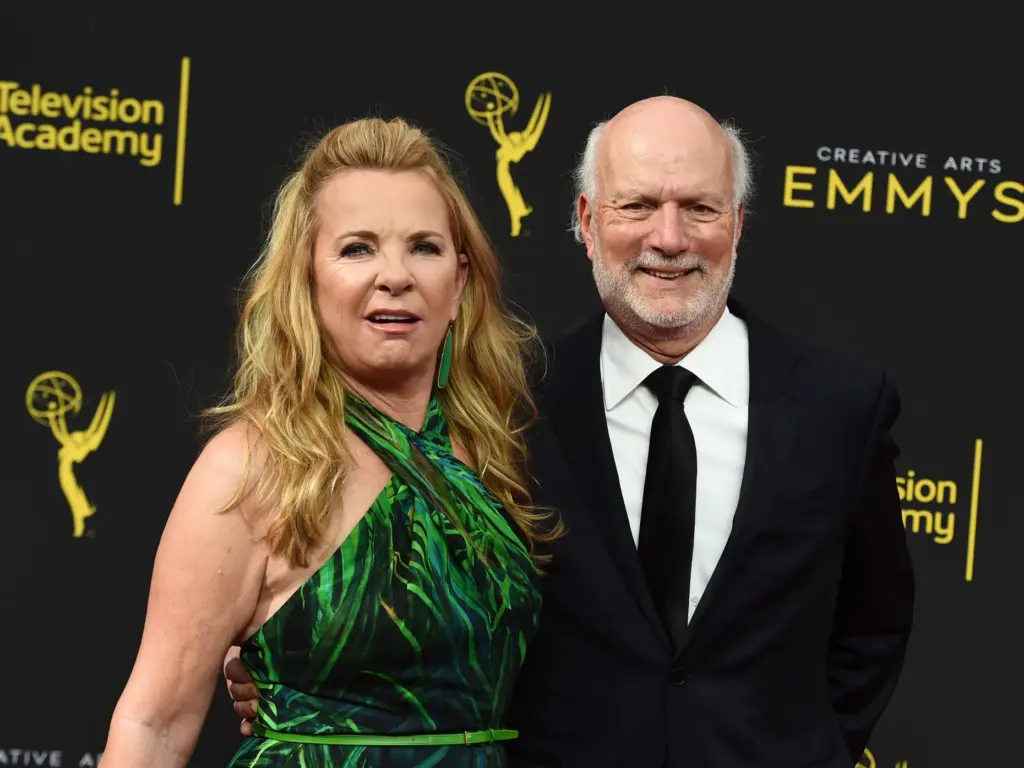 Debbie Easton, left, and James Burrows arrive at night one...