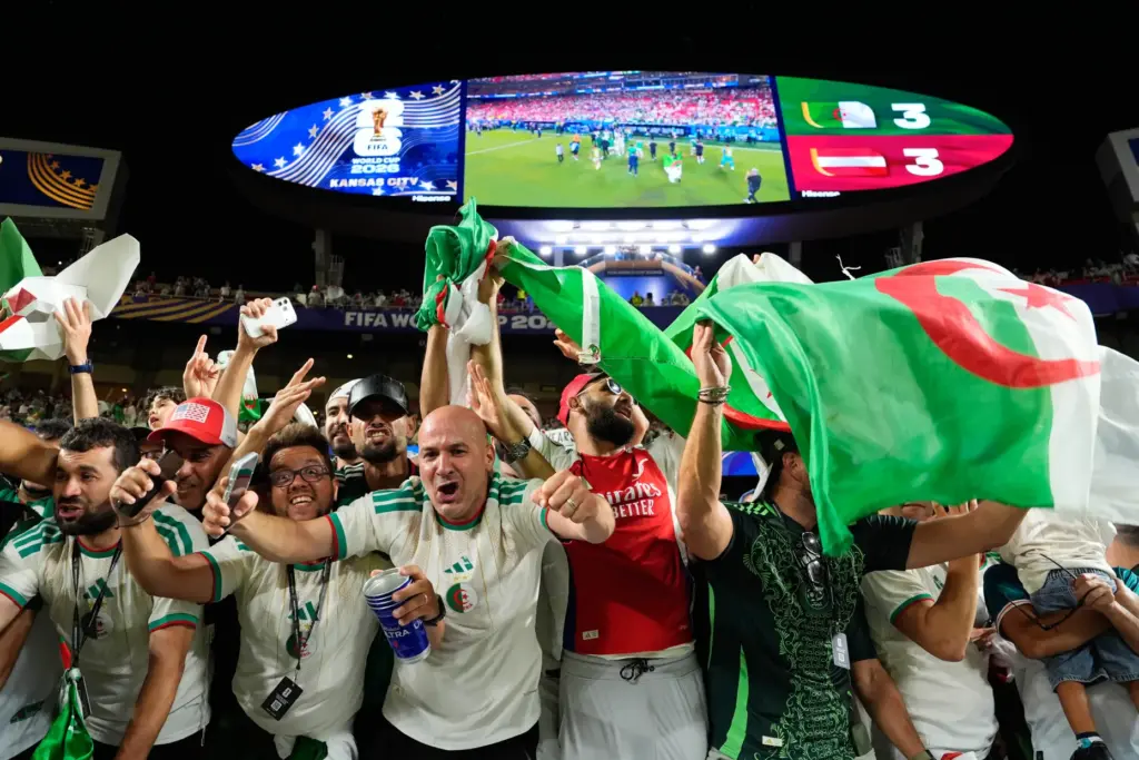 Fans cheer after the World Cup Group J soccer match...