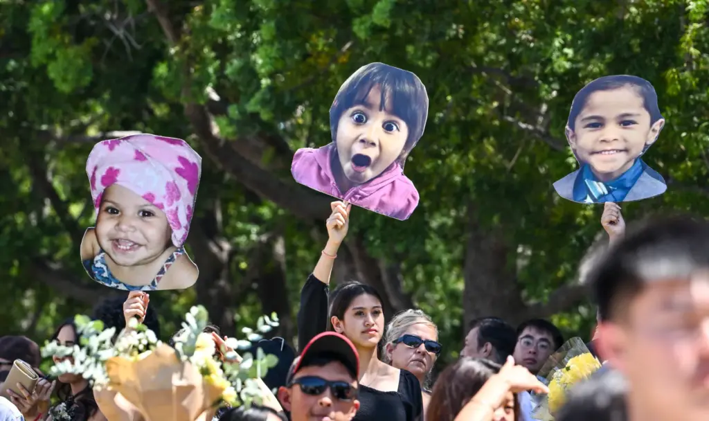 Friends and family wait for their graduate after the commencement...