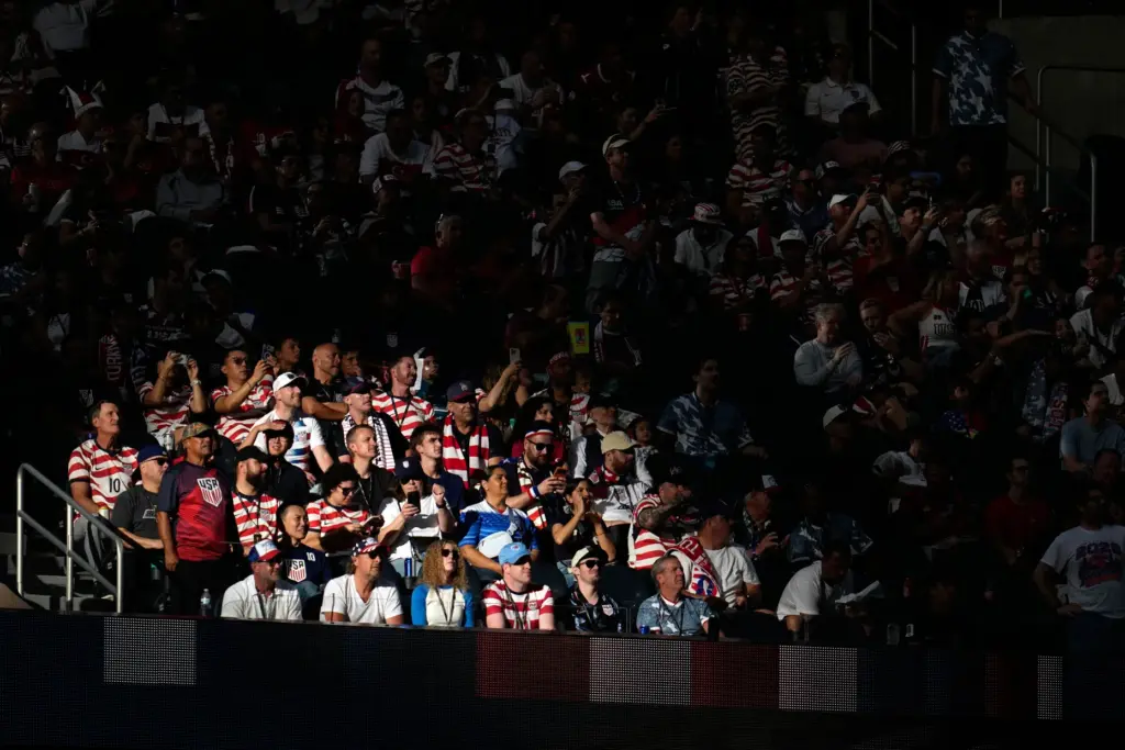 Supporters react during the World Cup Group D soccer match...