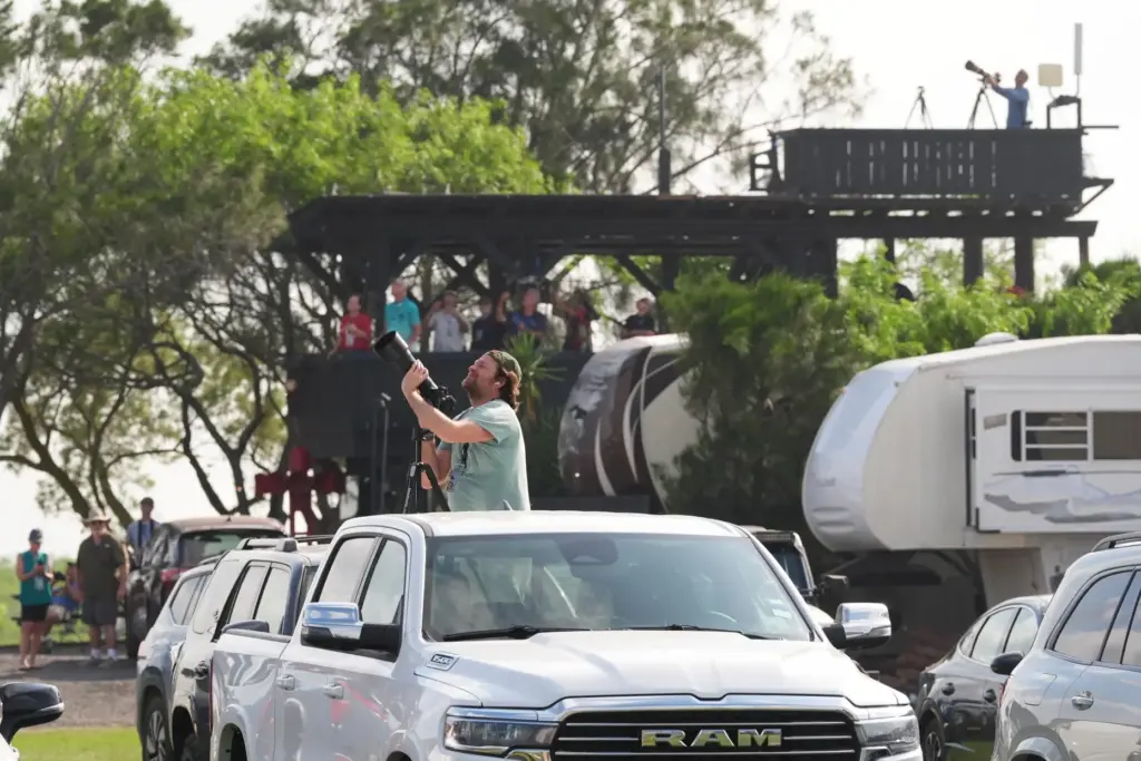People gather to watch as SpaceX's mega rocket Starship makes a test flight.