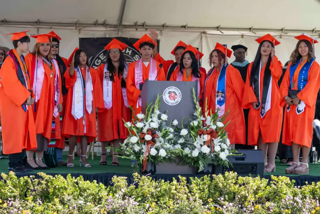 The Orange Chamber Choir Singers perform the schoolâs alma mater...