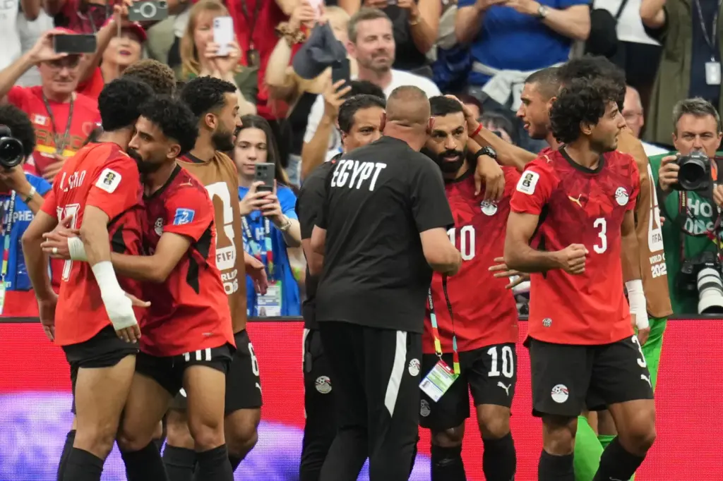 Egypt players celebrate after Mohamed Salah (10) scored his side’s...