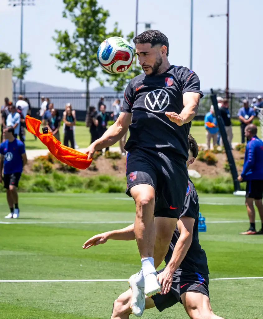 U.S. Menâs National Team player Christian Roldan practices with his...