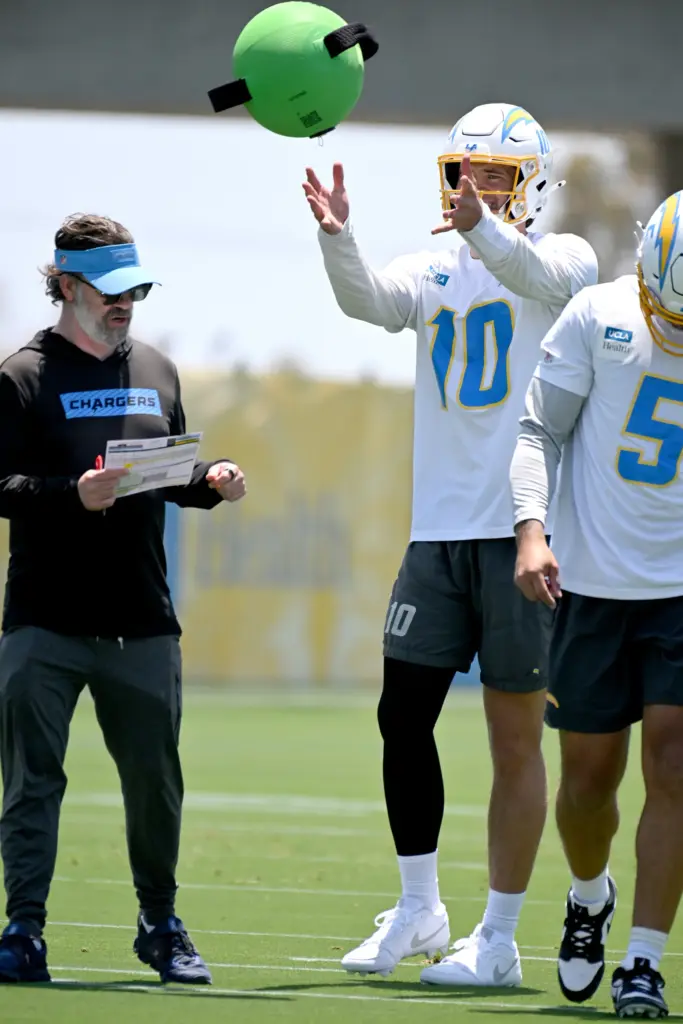 Chargers quarterbacks Justin Herbert (10) and Trey Lance (5) participate...
