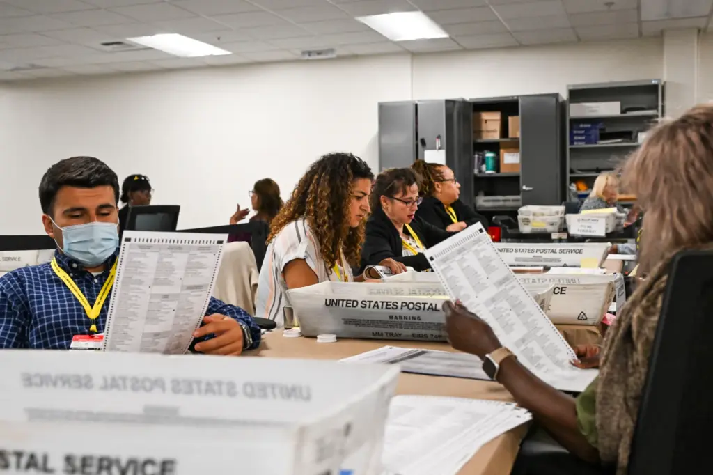 Temporary election assistants verify duplicated ballots Monday, June 1, 2026,...