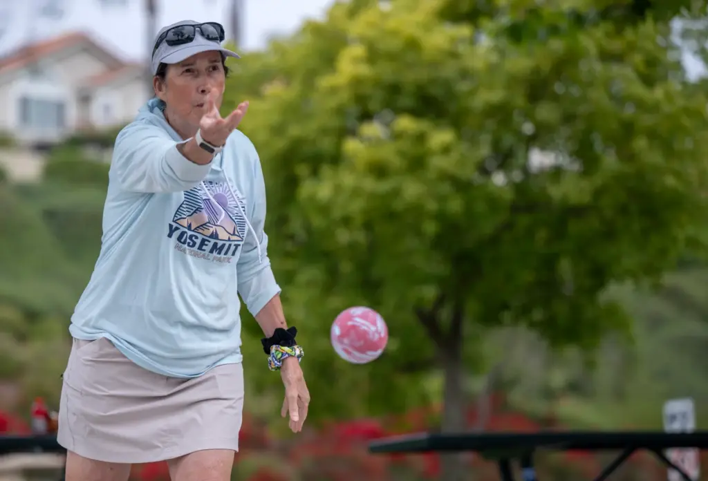 Susan Cryan of Mission Viejo tosses a bocce ball while...