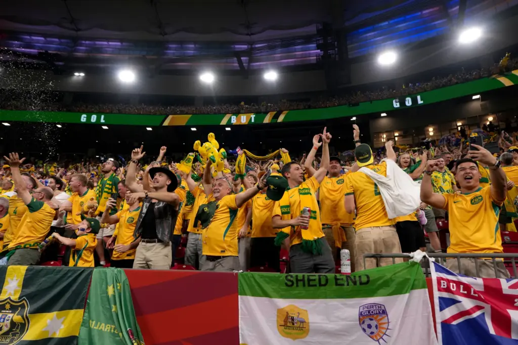 Australia fans celebrate a goal during first half Group D...