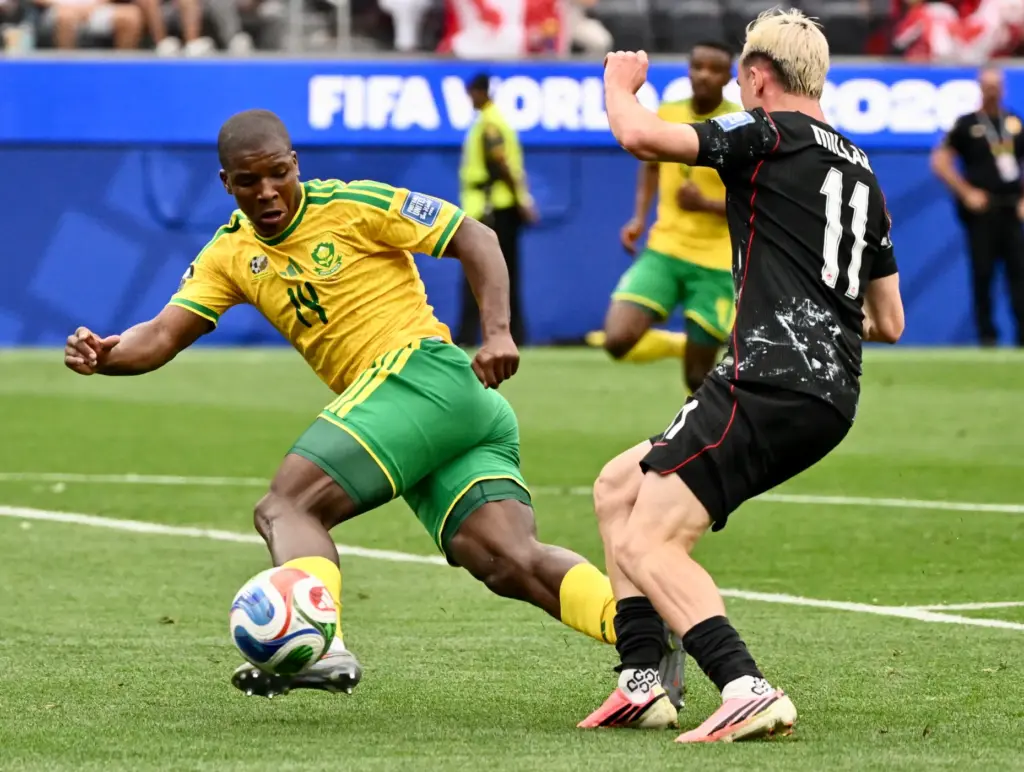 South Africa defender Mbekezeli Mbokazi (14) controls the ball past...