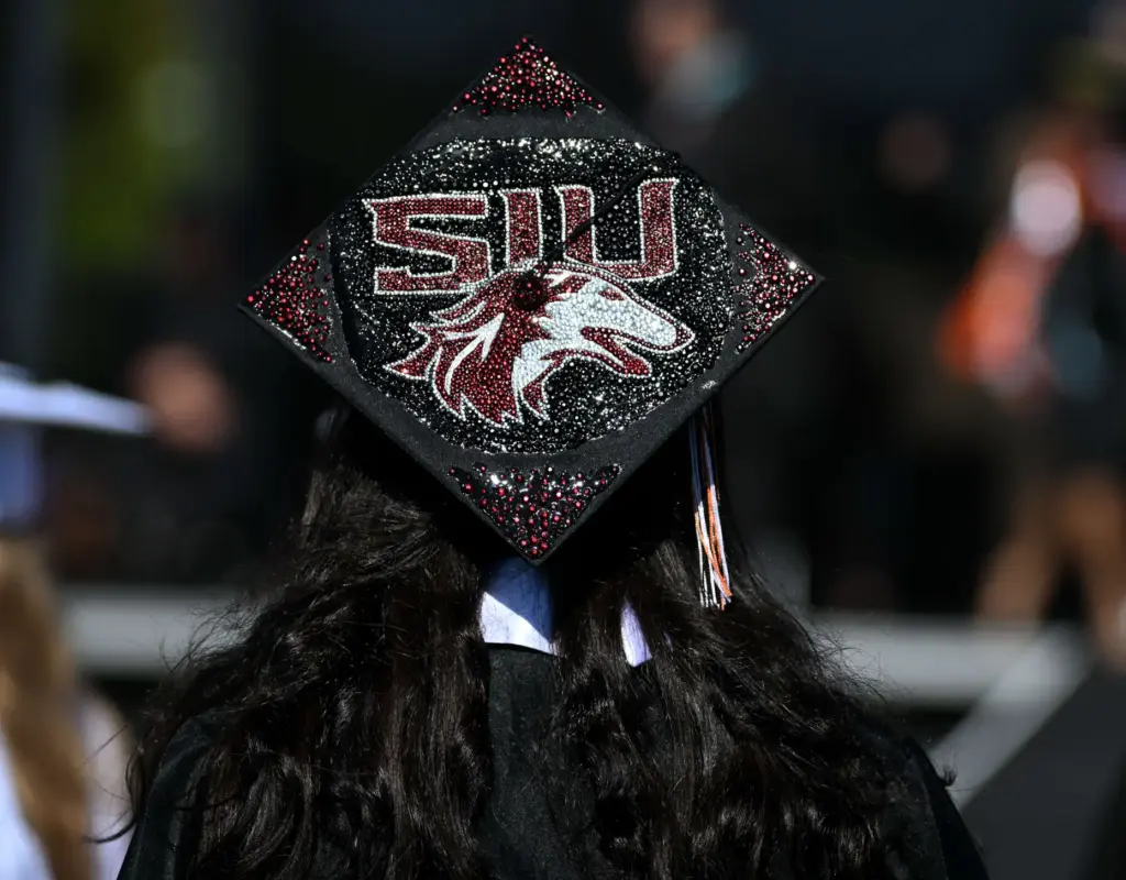 Huntington Beach High School graduates show their creativity by decorating...