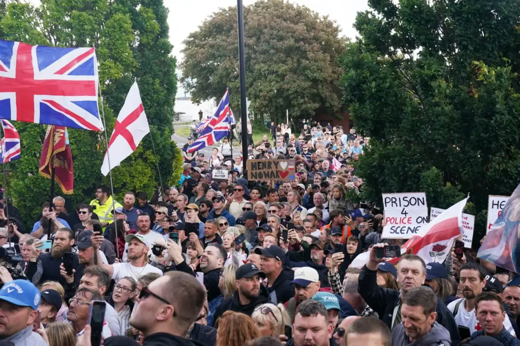 People gather to protest outside Southampton police station, Southampton, England,...