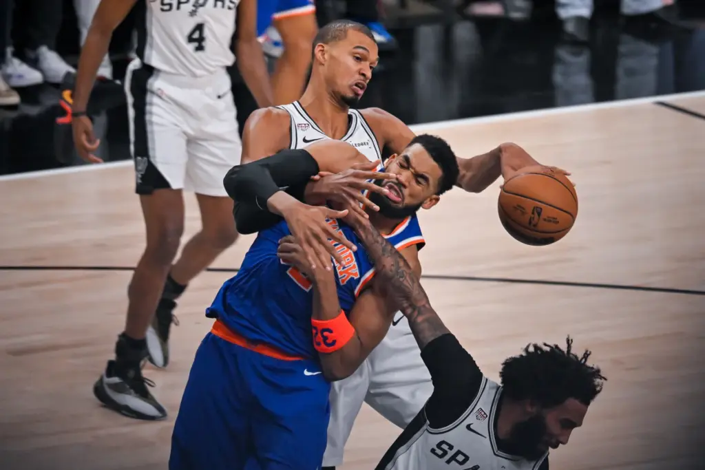 San Antonio Spurs forward Victor Wembanyama knocks the ball away...