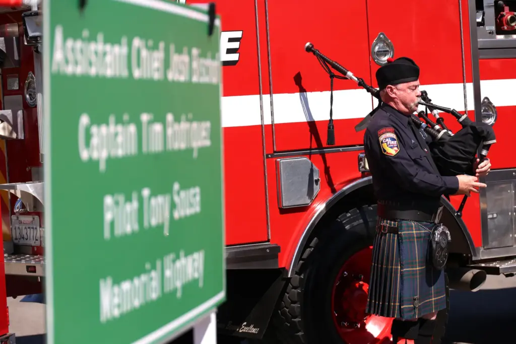 A bagpiper plays at Fridayâs ceremony dedicating a stretch of...