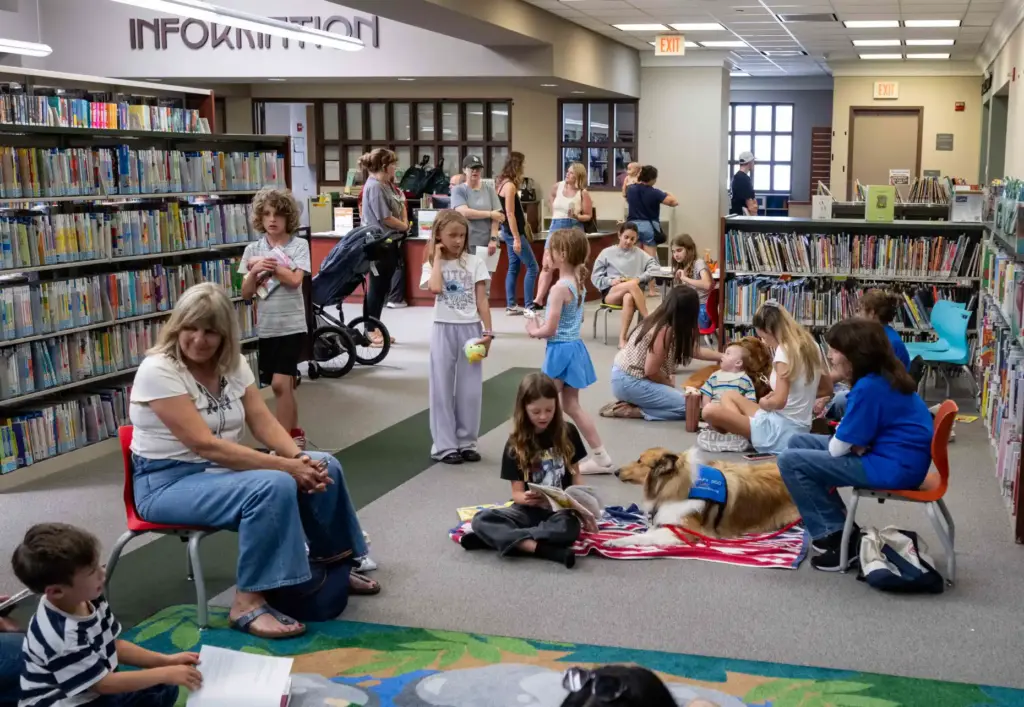 Kids read to three dogs from Orange County Animal Alliesâ...