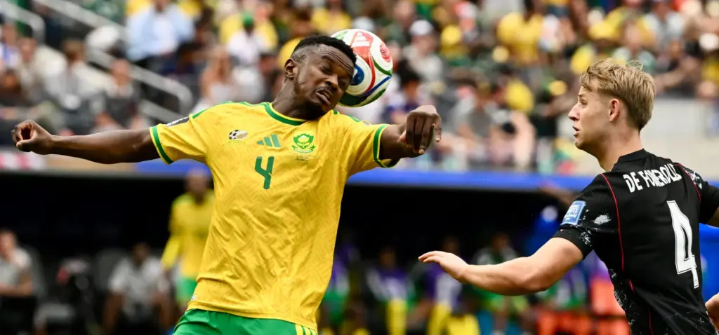 South Africa midfielder Teboho Mokoena (4) with the header against...