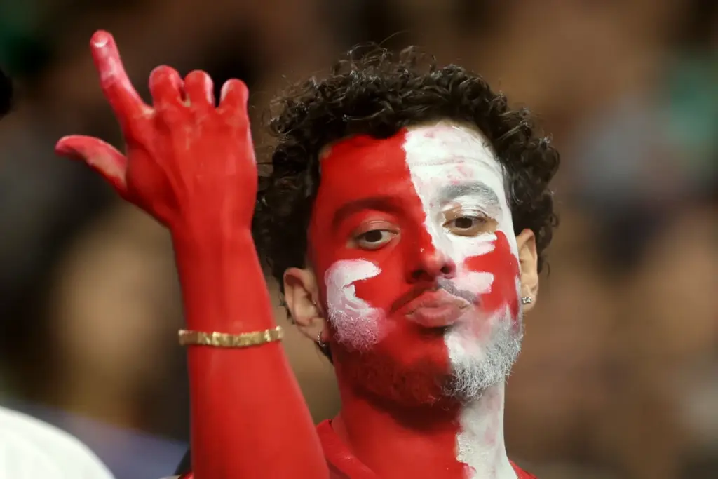 A Turkey fan reacts during the second half of a...