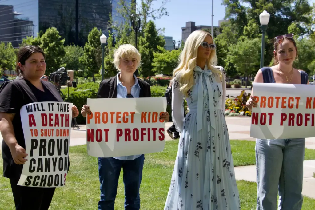 Paris Hilton appears alongside fellow survivors of residential teen treatment facilities.