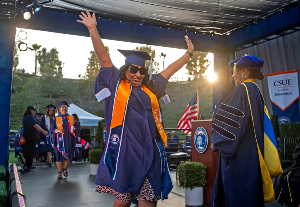 Corinna Castillo celebrates her graduation during CSUF College of Educationâs...