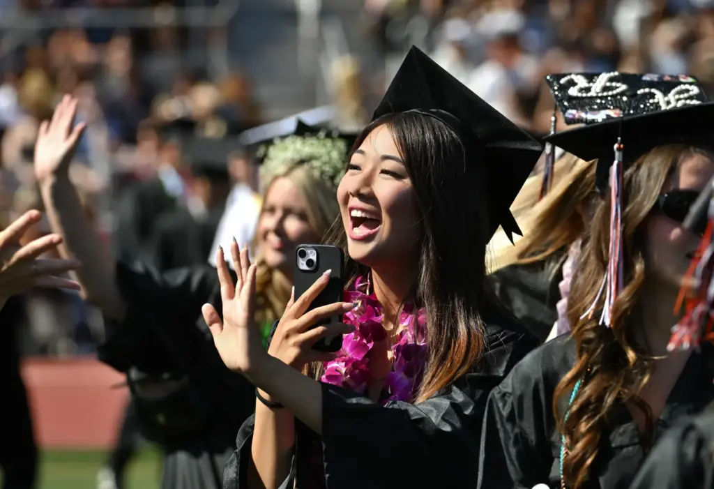Hana Nozaki smiles as she waves to to friends at...