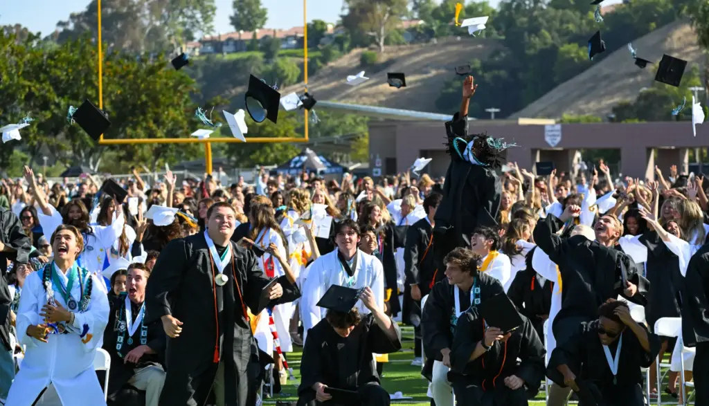 Graduates celebrate during the Aliso Niguel High Schoolâs commencement ceremony...