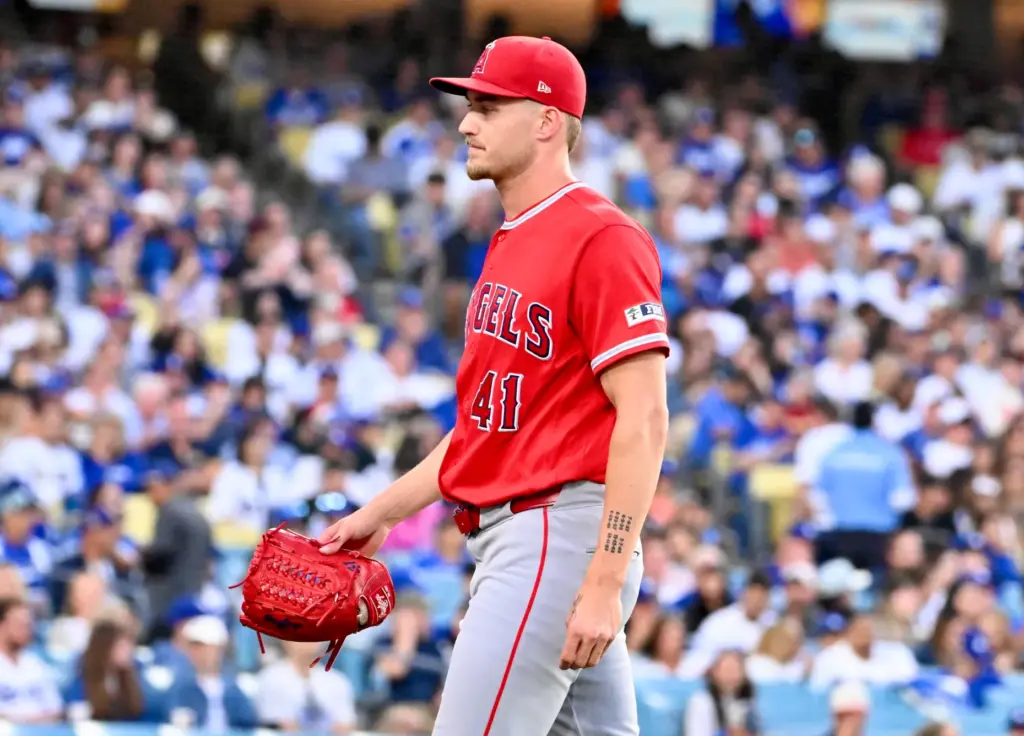 Starting pitcher Jack Kochanowicz #41 of the Angels is pulled...