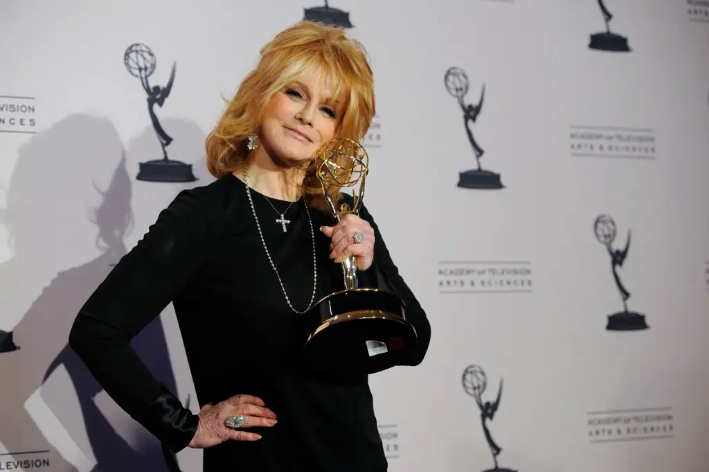 Ann-Margret poses in the press room with the award for...