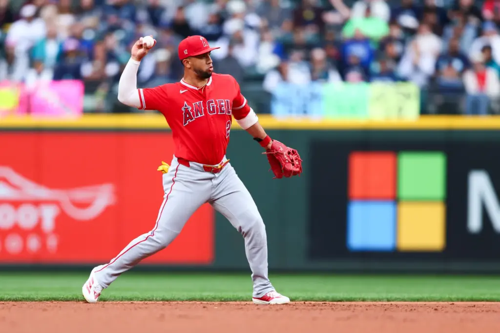 Angels second baseman Oswald Peraza throws to first base during...
