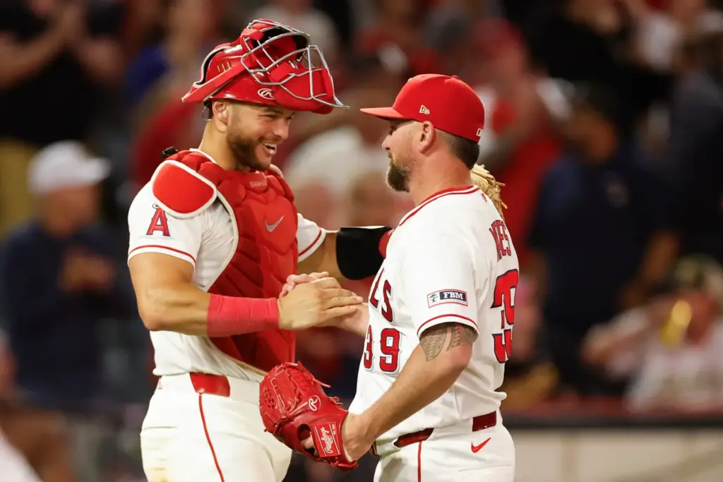 Angels catcher Logan O’Hoppe, left, Los Angeles Angels relief pitcher...
