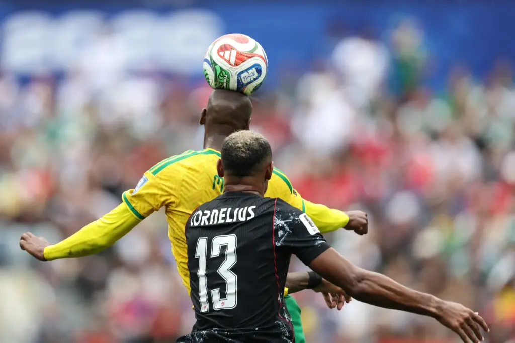 South Africa forward Evidence Makgopa (17) heads the ball against...