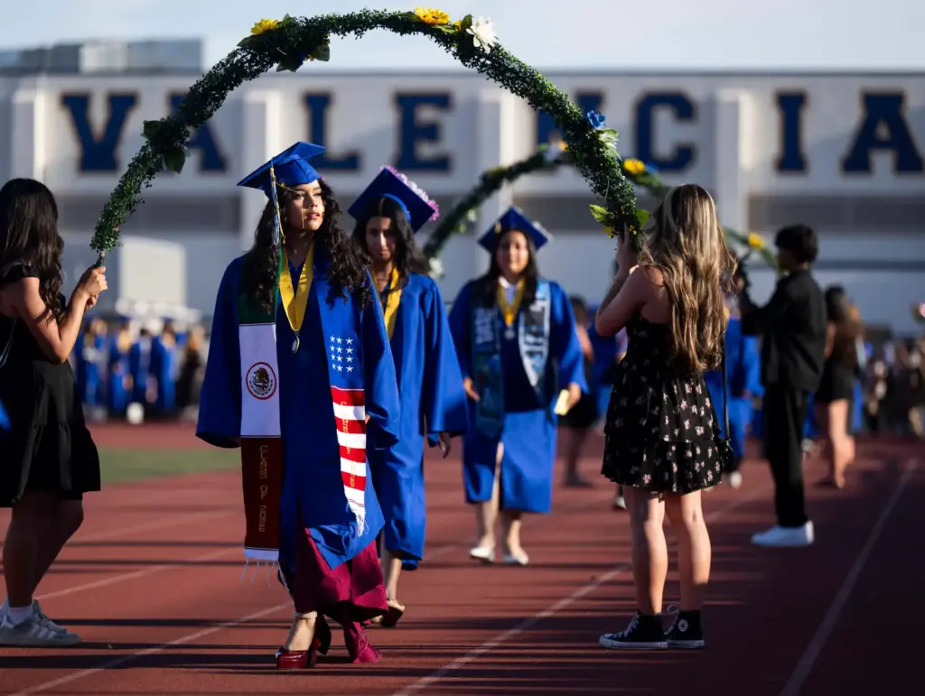 Graduates enter Bradford Stadium for the Valencia High School graduation...