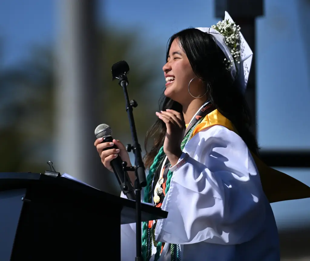 Class Speaker Cate Le smiles as she talks to the...