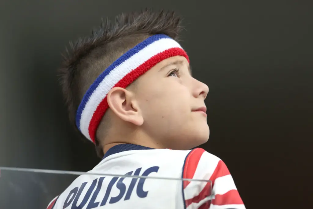 A United States fan looks on before the start of...