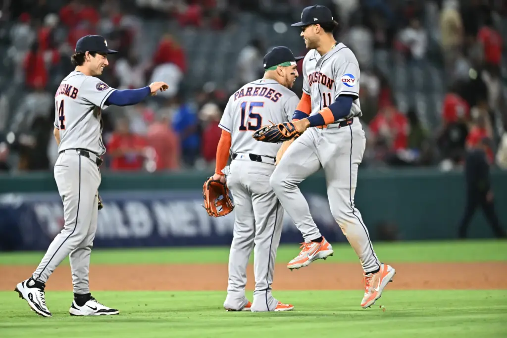 Houston Astros right fielder Cam Smith, right, is greeted by...