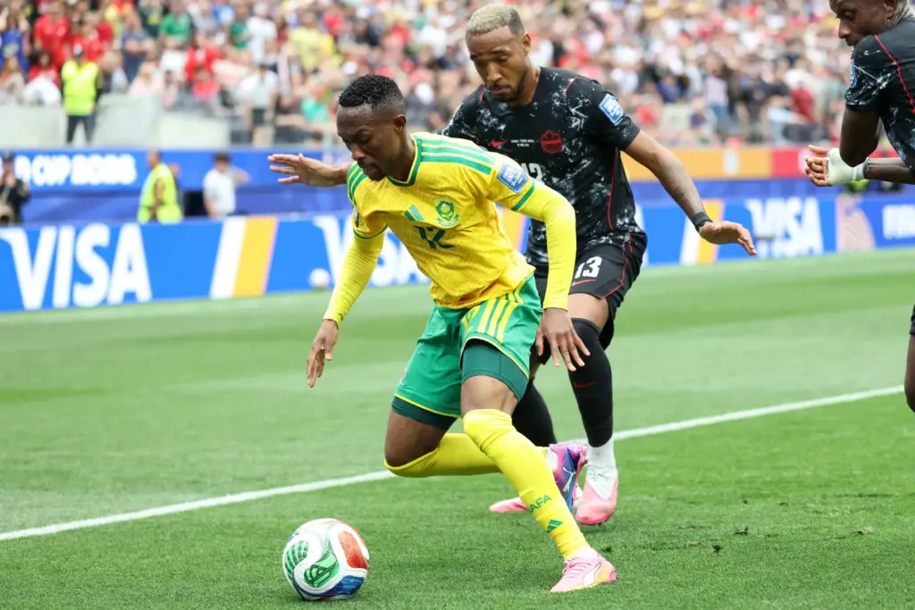 South Africa midfielder Thapelo Maseko (12) controls the ball defended...