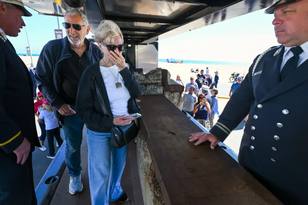 Kathy Morgan pauses as she visits a steel beam from...