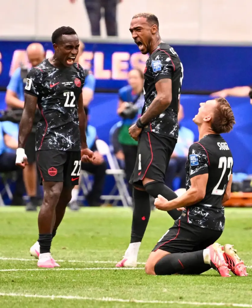 Canada defender Richie Laryea (23) celebrates with teammates Canada defender...