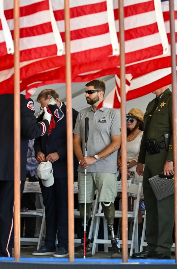 Retired Marine Scott Nokes attends a ceremony for a piece...