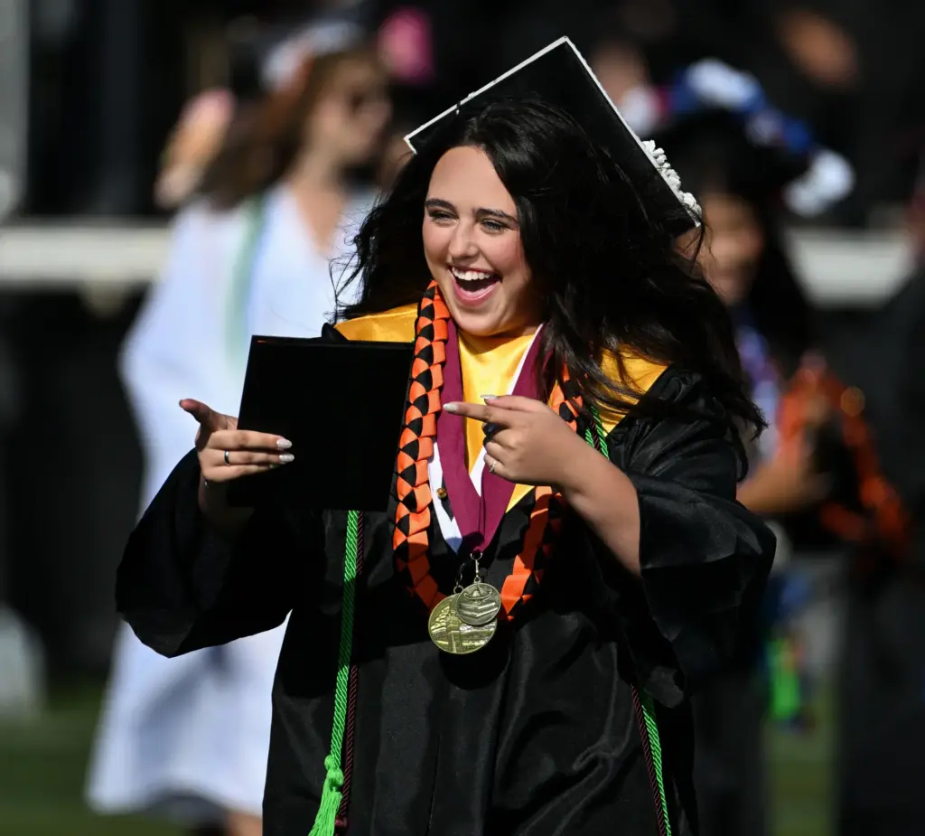 Laney Laughlin shows a big smile after receiving her diploma...
