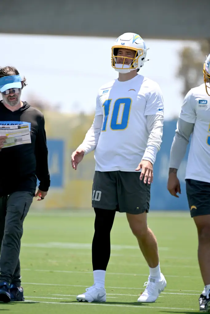 Chargers quarterbacks Justin Herbert (10) and Trey Lance (5) participate...