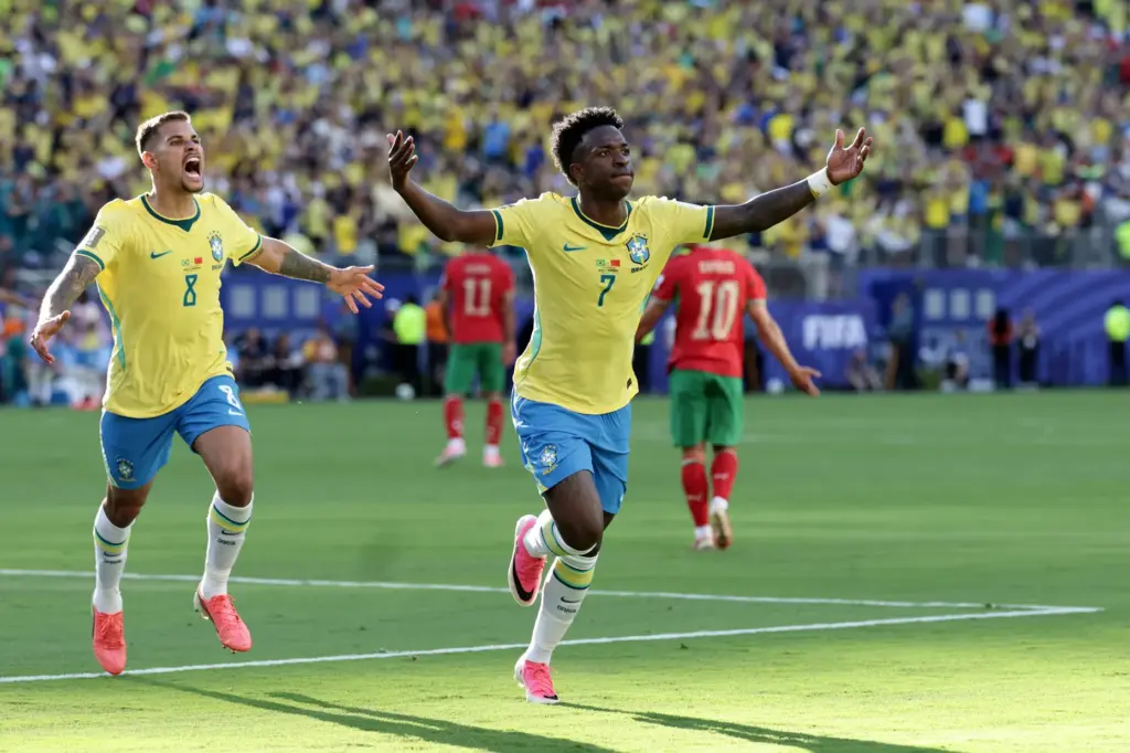Brazil’s Vinicius Junior (7) celebrates a goal in the first...