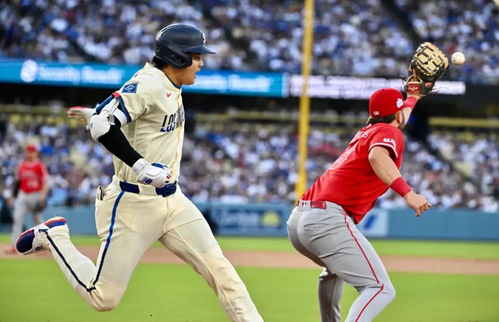 Shohei Ohtani #17 of the Dodgers singles as first baseman...